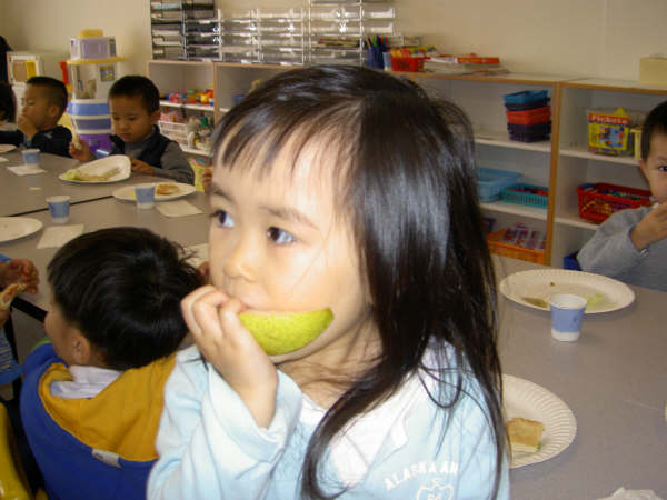 student eating fruit.
